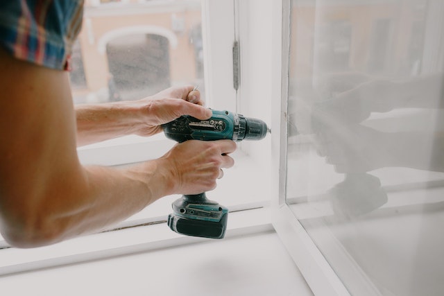 Close up of someone using a drill